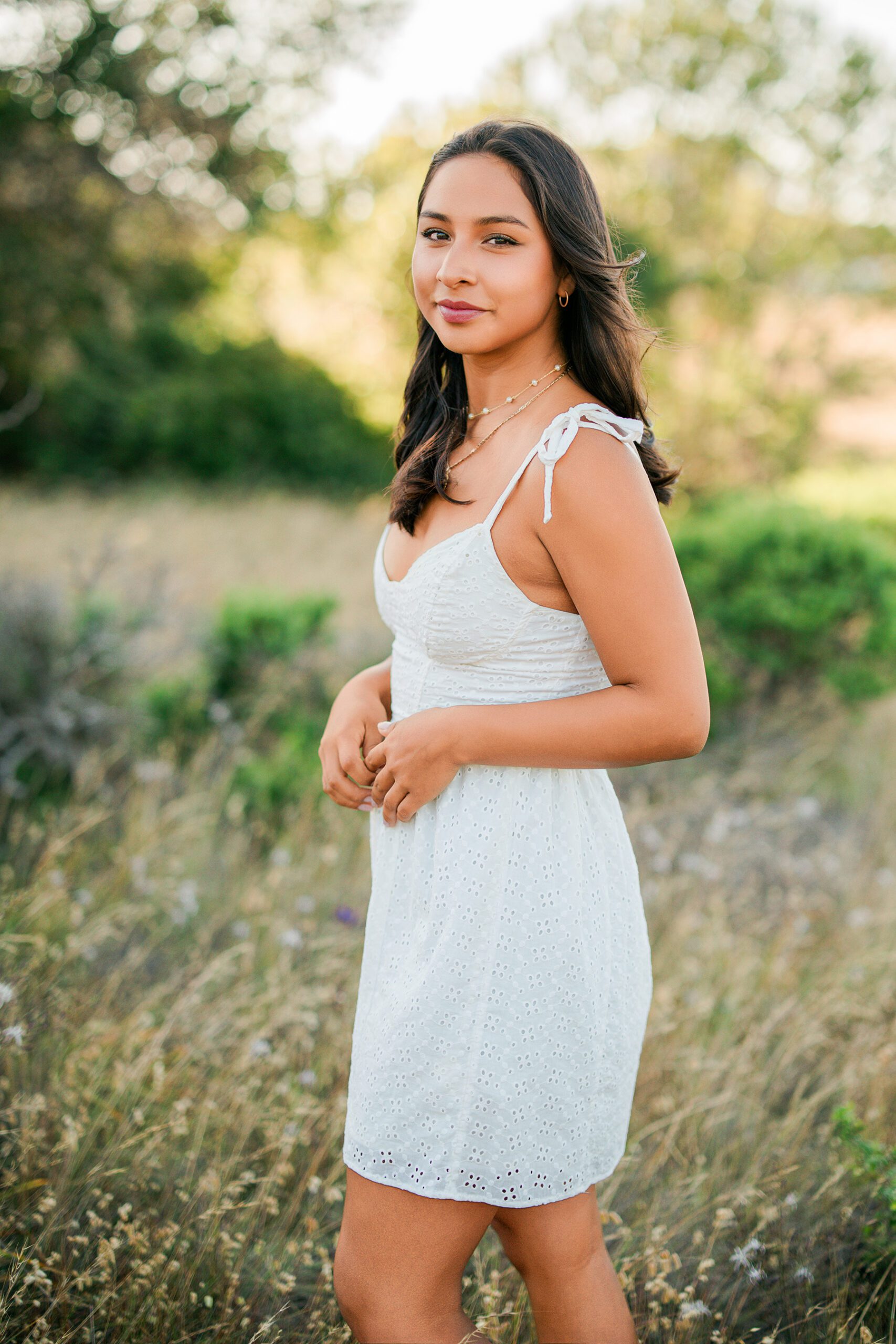 Branson School senior portrait in Marin grasslands during warm summer golden hour session