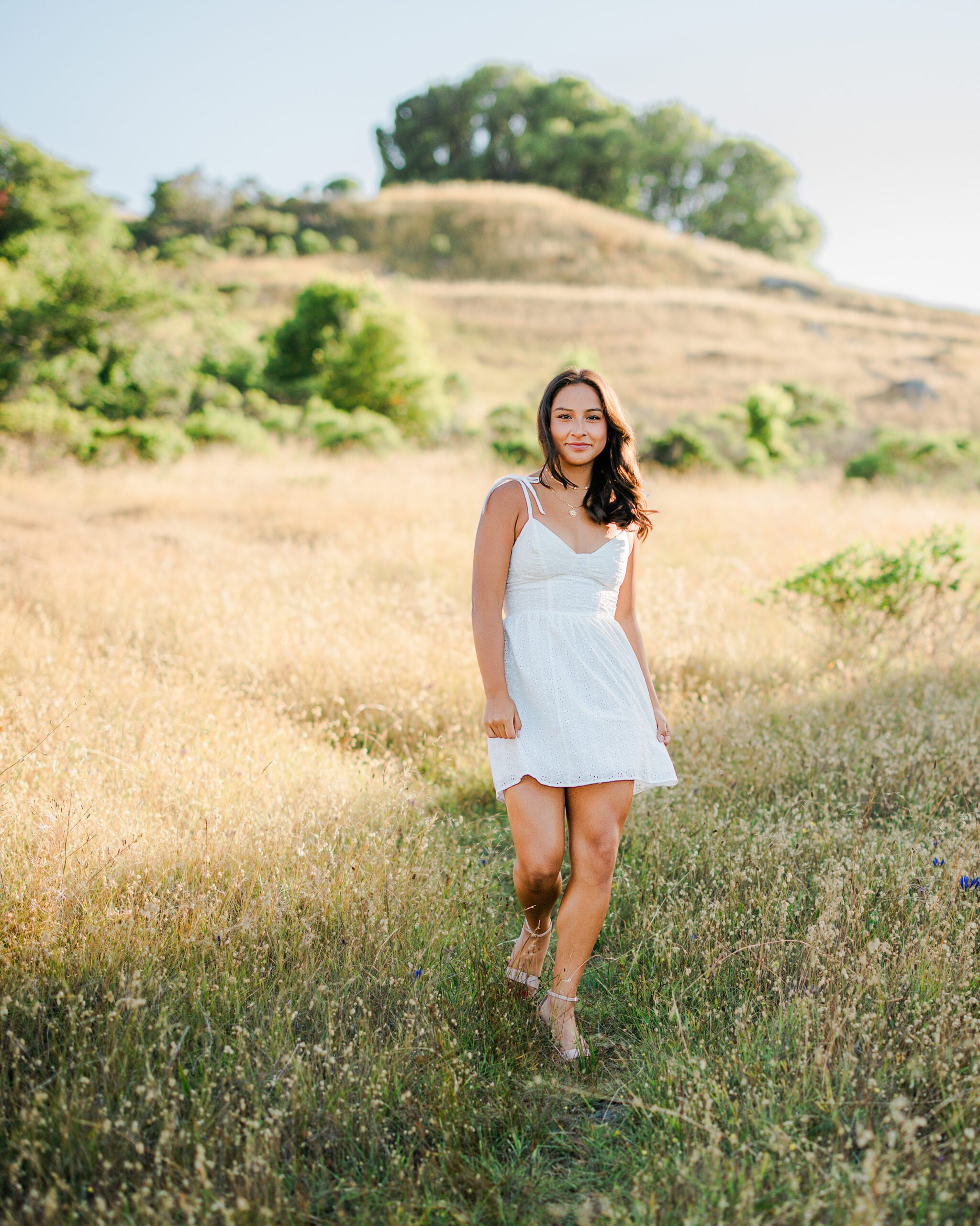 Branson School senior walking through Marin golden hills during summer portrait session