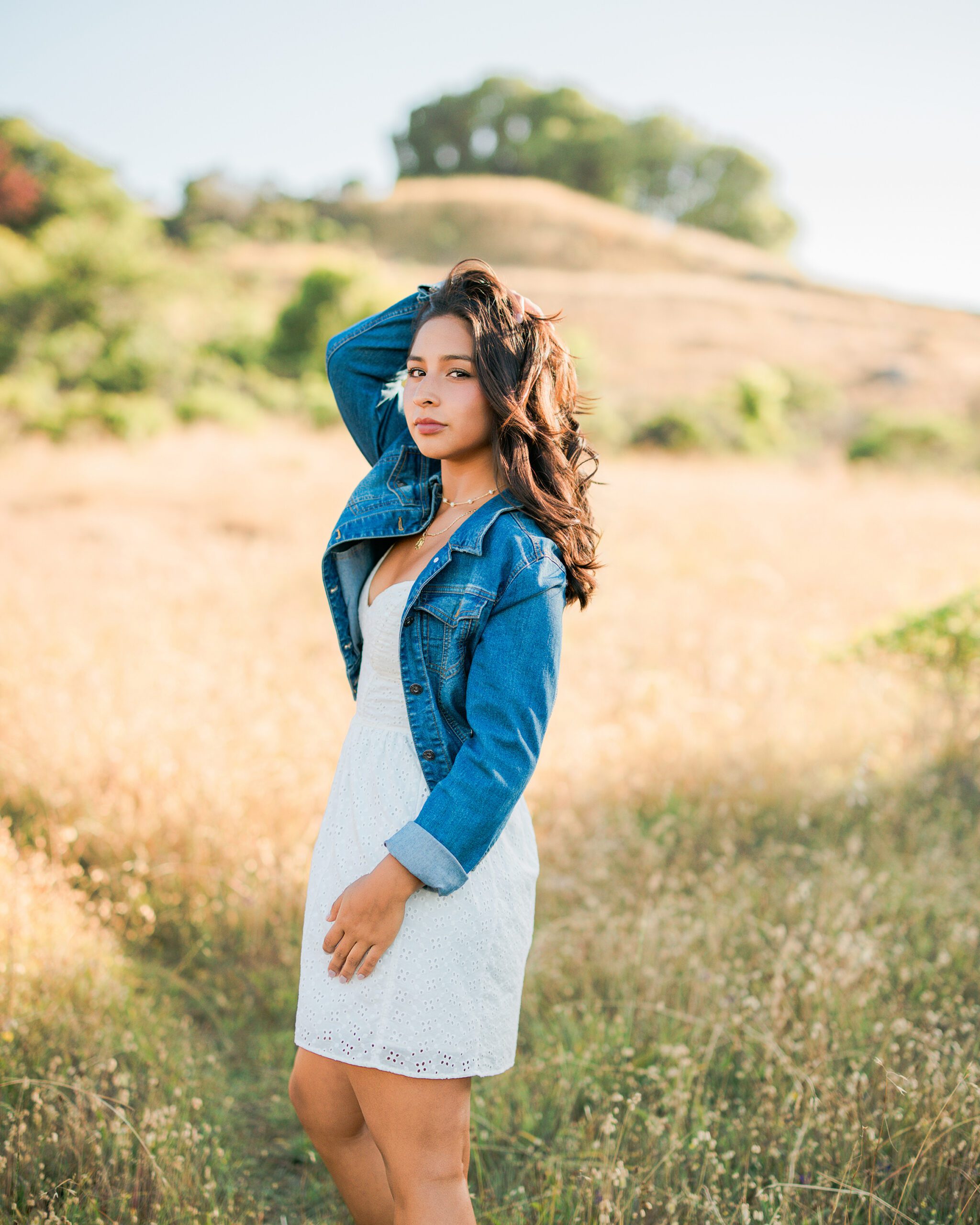 Branson School senior portrait in denim jacket photographed in Marin golden hills during summer session