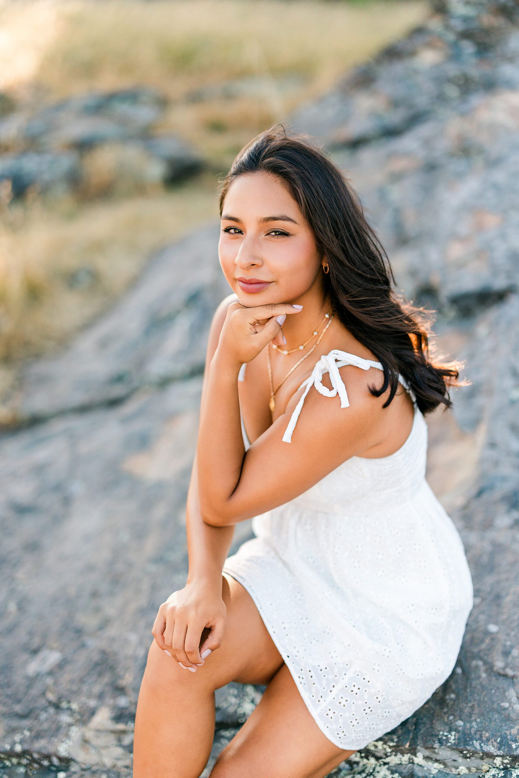 Branson School senior portrait sitting on coastal rocks in Marin during golden hour summer session