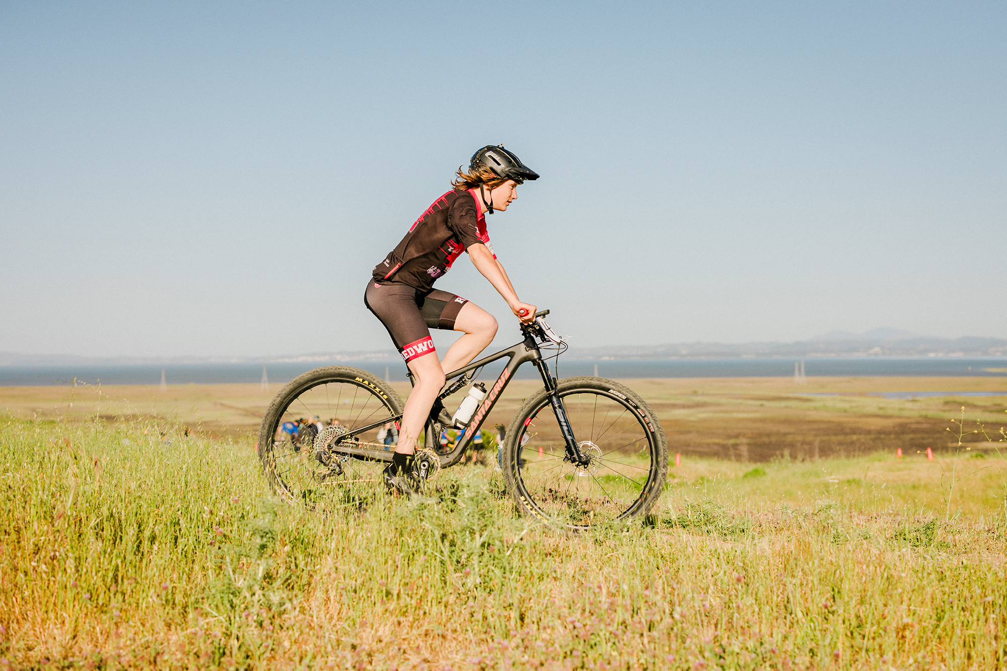Redwood High School mountain biker racing on a Marin County trail during a cycling competition