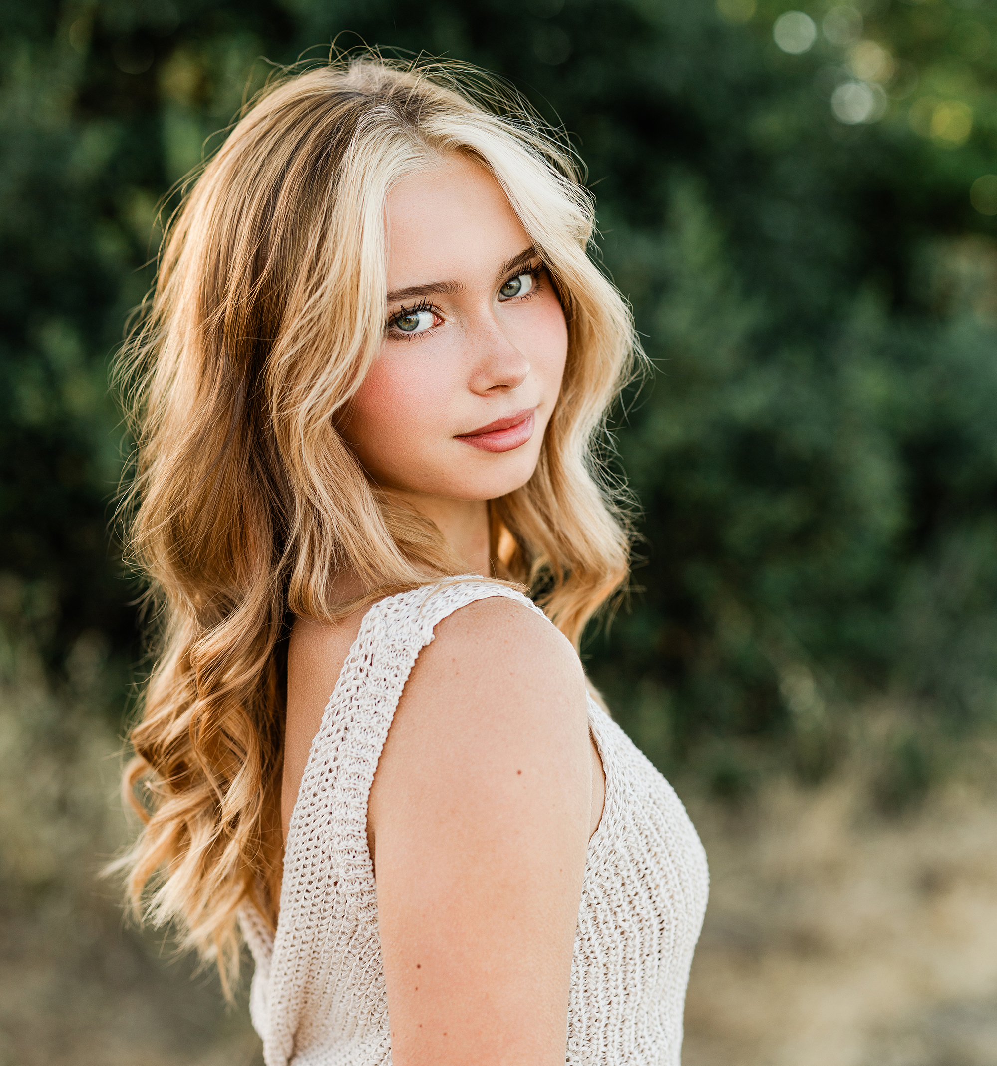Close-up portrait of rising senior Sofia making eye contact during her Marin senior portrait session at sunset.